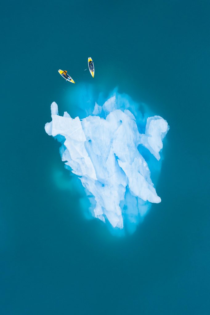 Paddleboarding Glacier Lake Icebergs in Alaska - Outdoor Adventure Aerial Photography by Toby Harriman - 1